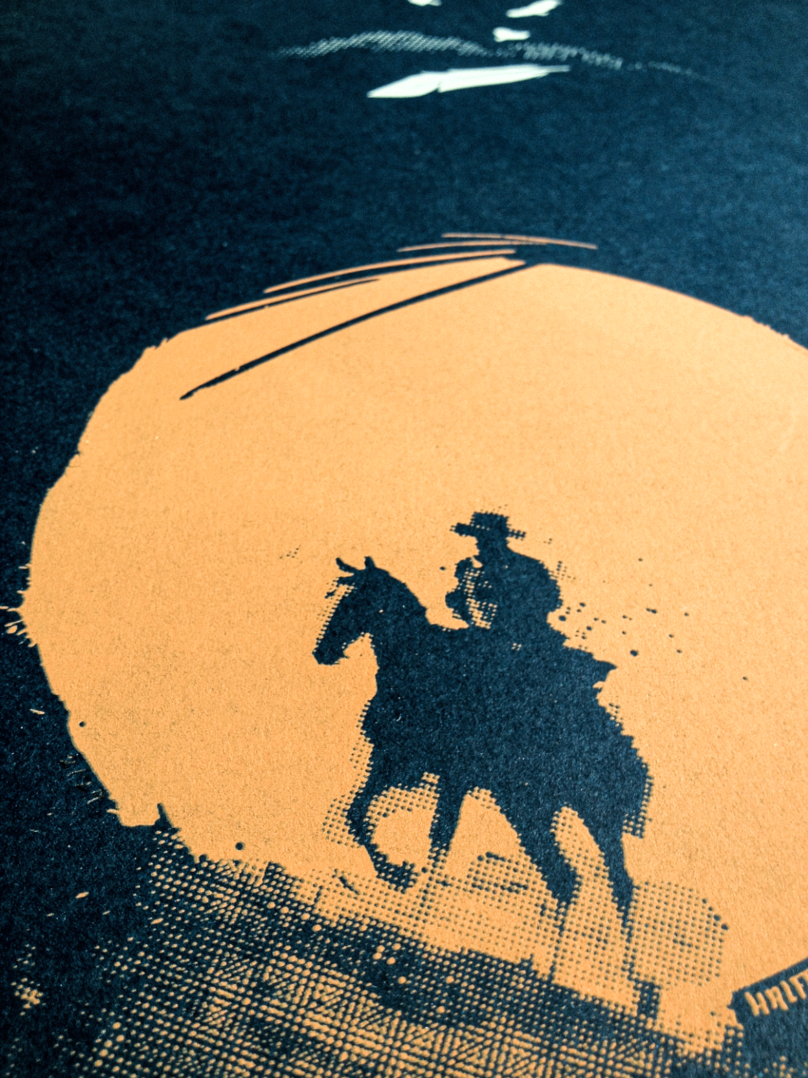 Screen print of cowboy on horse in orange on dark blue paper