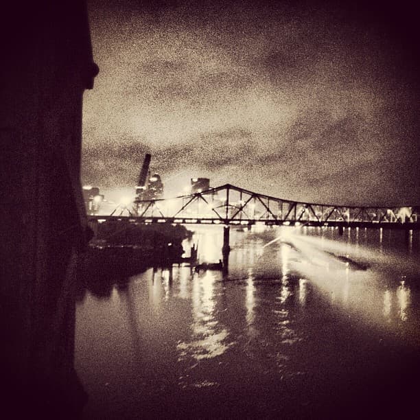 Late night on the Ohio river just outside Louisville, KY with construction spotlights illuminating the water