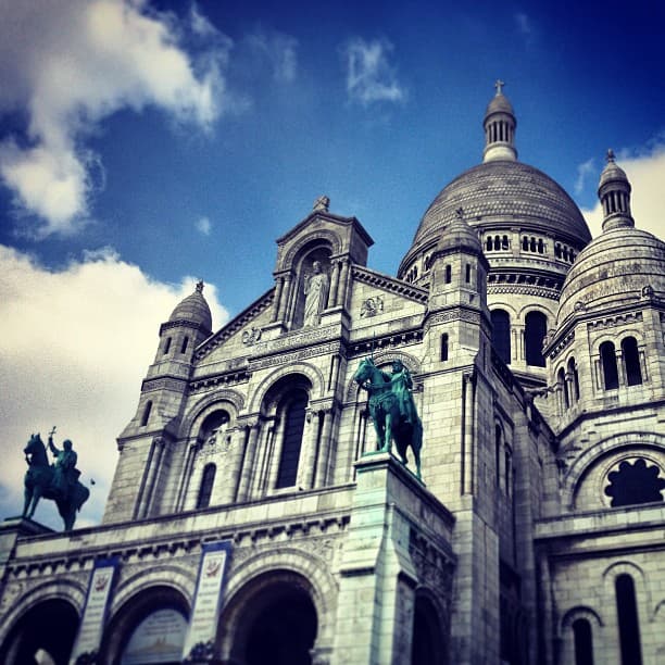 Sacre Coeur with blue sky and clouds behind