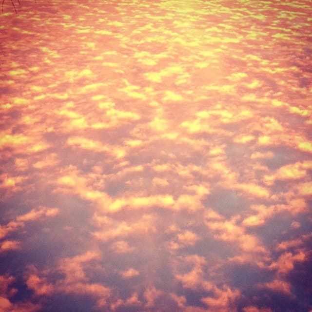 Orange and pink rosy cloud pattern